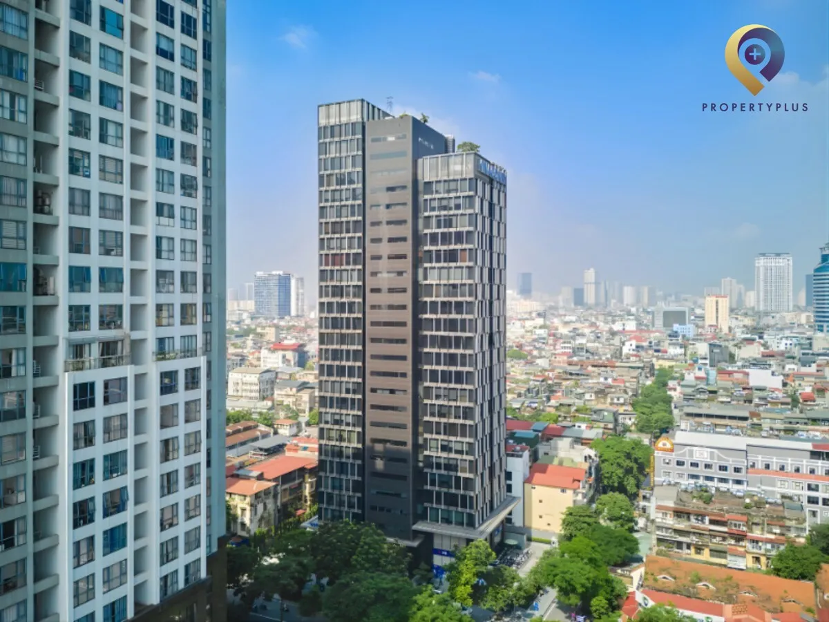 Vinaconex Tower exterior overview from above, surrounded by cityscape.